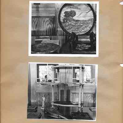 Close up of the wood carving exhibit including bellows, cowboy, and plates 1942