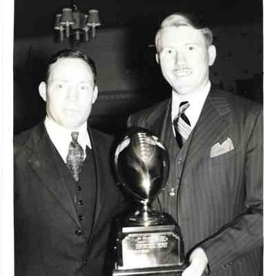 Coaches Roy Lackey and Mlleni Aruern holding Clover Park trophy, 1939