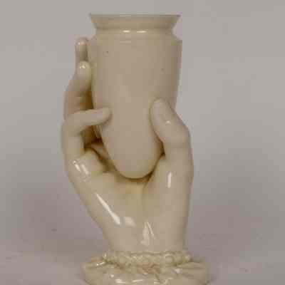 Hand holding a vase