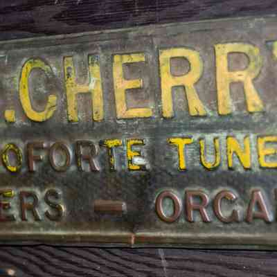 Pressed tin sign