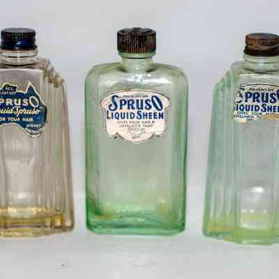Three bottles of Spruso hair oil