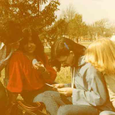 Photograph of Carolina Cayuela and three unidentified students