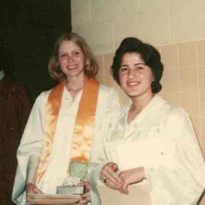 Photograph of Ghada Yashar and Daisy Hancock at graduation, Jun 1976