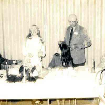 Photograph of Charles Fulton, Jan Willey, Jennie Fulton, and others at Jan Willey’s birthday party, Mar 1972