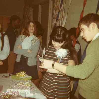Photograph of Norma Martinez, John Hewlett, and others at AFS Party, Mar 1970