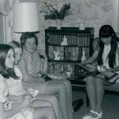 Photograph of Regina Trader, Esther Costello, Anne Timmons, and Norma Martinez at AFS Open House Apr 1970
