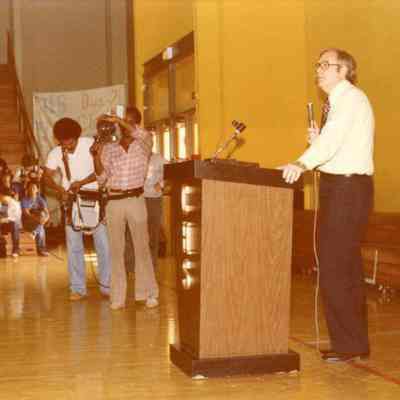 Photograph of man giving speech