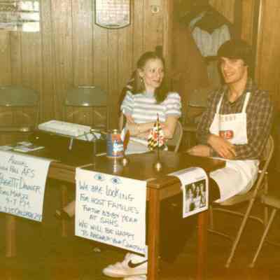 Photograph of Thierry Huguet and unknown girl at AFS Spaghetti Dinner, Mar 1983