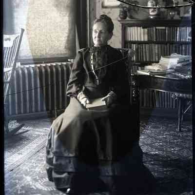 Woman Seated in Chair with Book