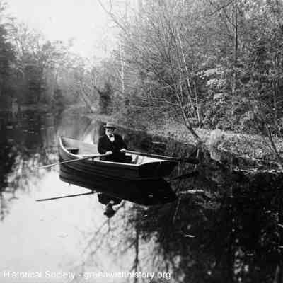 E. C. Benedict in Rowboat