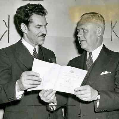 Quinto Maganini and Wilbur M. Peck
