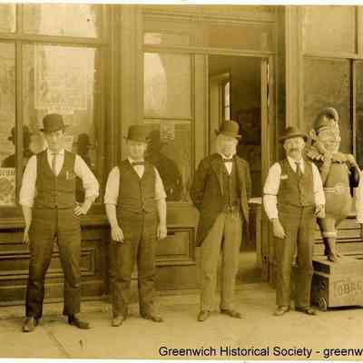 Men and Boy in Front of Greenwich Store