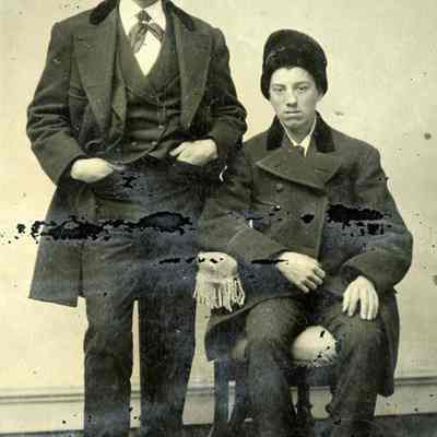 Young Men in Winter Coats and Hats
