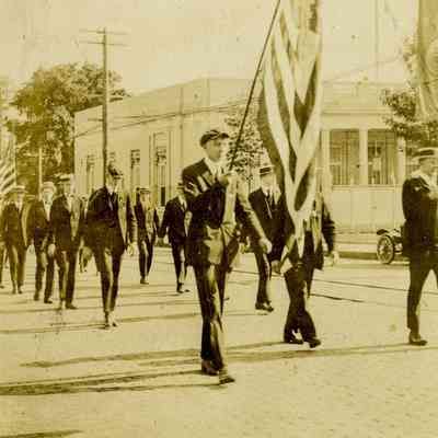 Men Marching with Flag