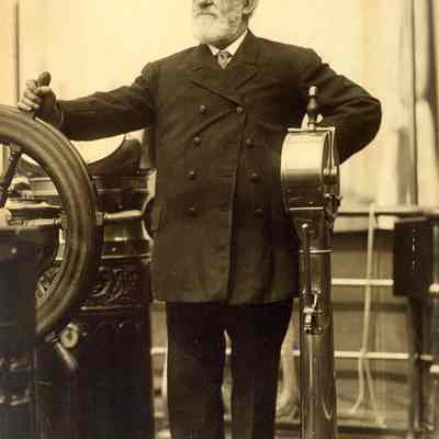 Commodore E. C. Benedict at the Wheel