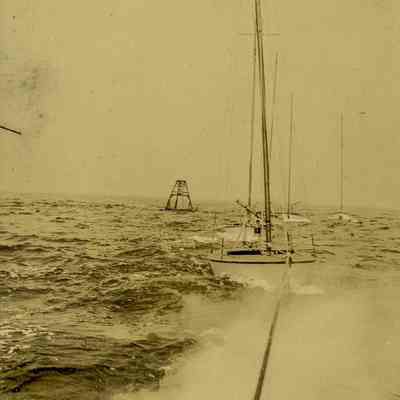 Sailboat Being Towed in the Sound