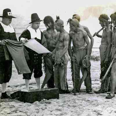 Men in Costume as Native Americans and Settlers A
