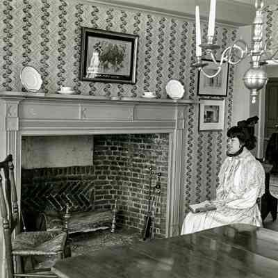 Woman by Fireplace A