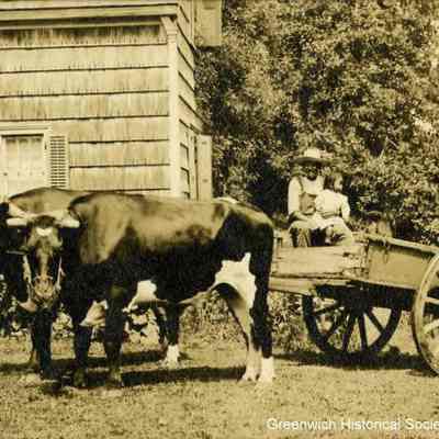 Laborer and Child in a Cart