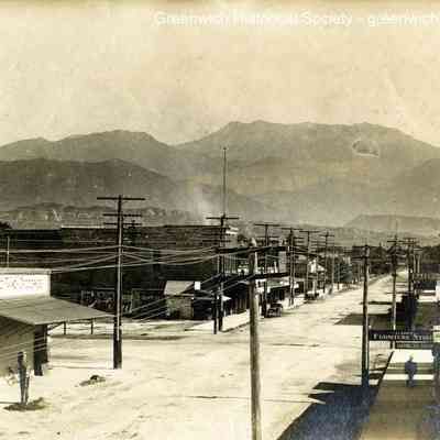 Unknown Street Scene with Mountains