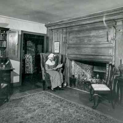 Woman by Parlor Fireplace