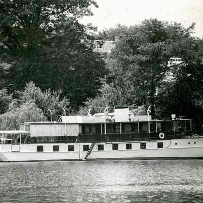 Ferry Moored near a House