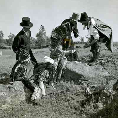 Men in Costume as Native Americans and Settlers B
