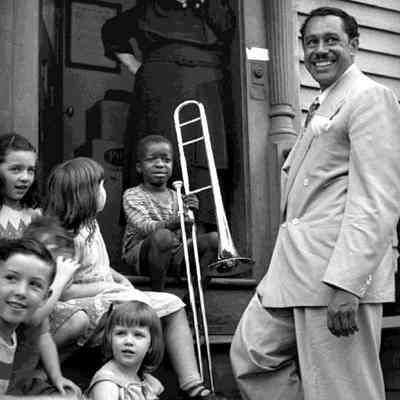 Cab Calloway with kids and winner of Calloway Quizzicale, Providence, RI, c. 1938
