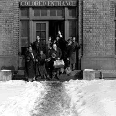 Chu Berry, Danny Barker, Rudolf Rivers, unidentified, Quentin Jackson, Cozy Cole, Tyree Glenn, and Cliff (Cab Calloway’s valet), railroad station, Atlanta GA