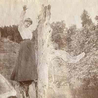 Woman climbing a tree
