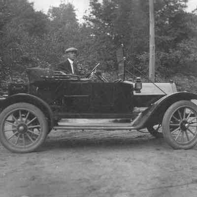 Man next to car 6-0335