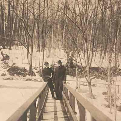 Men on Bridge in Winter