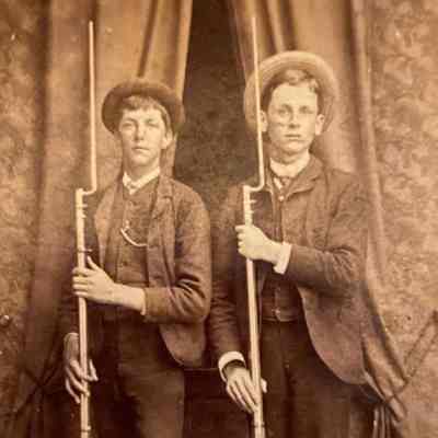 Teenage Boys holding rifles