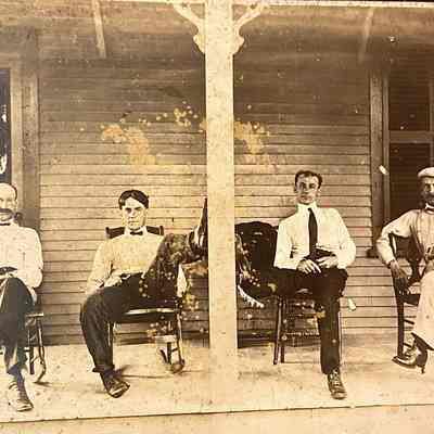 Four Men sitting on Porch
