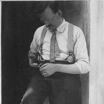 Man holding pocket watch 5-280