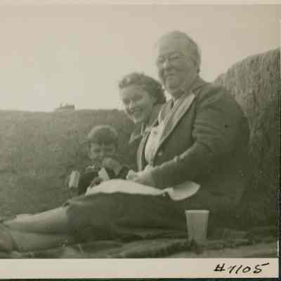 Alice Moore Peasley, Maine Seacoast Mission minister on a picnic with small boy and two women.