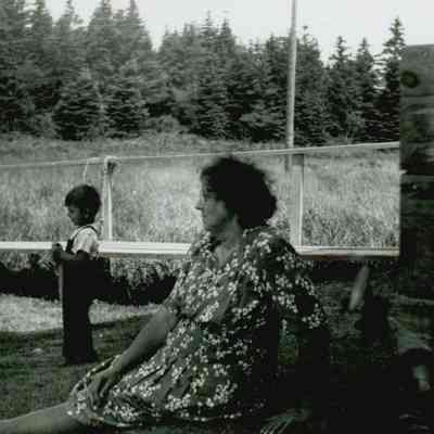 Young John Workman and his grandmother, Daisy Myrick Workman, playing outside of the Prospect Harbor Lighthouse.