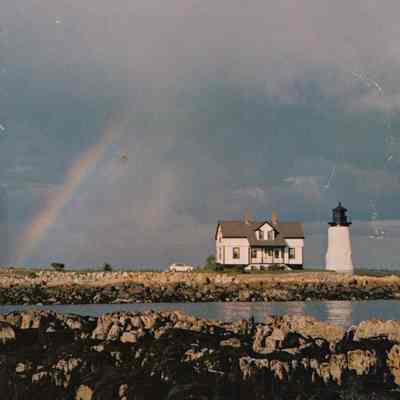 Prospect Harbor Lighthouse and Keeper's Cottage with rainbow.