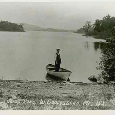 Man in boat on Jones Pond, West Gouldsboro ME. 152.