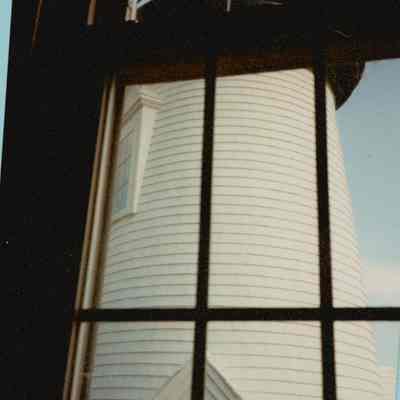 Prospect Harbor Lighthouse tower through interior window.