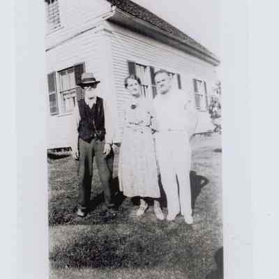 John Hutchings and Alice Bunker Hutchings with Roy Hutchings.