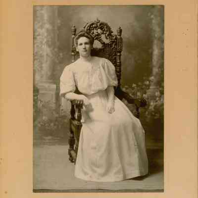 Dorothy Dresser sitting in a chair
