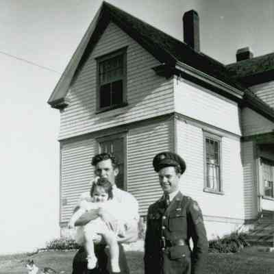 Allison, Ann Marie, and Gordon Workman in front of the Keeper's Cottage at the Prospect Harbor Lighthouse.