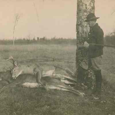 Leonard Ray with two deer carcasses