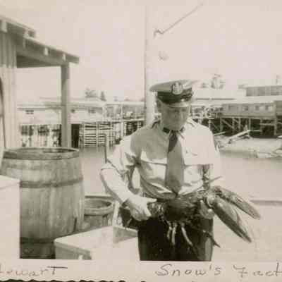 Roy Stewart holding a giant lobster.