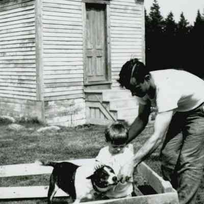 John and Gordon Workman, Sr. with their dog, Pal, outside of the Prospect Harbor Lighthouse.