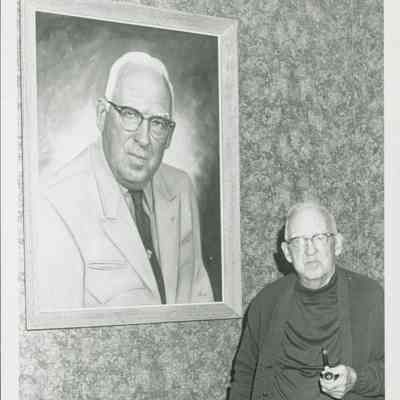 Calvin Stinson Sr. with his portrait.