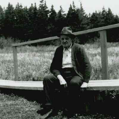Ira Nash Workman sitting outside of the Prospect Harbor Lighthouse.