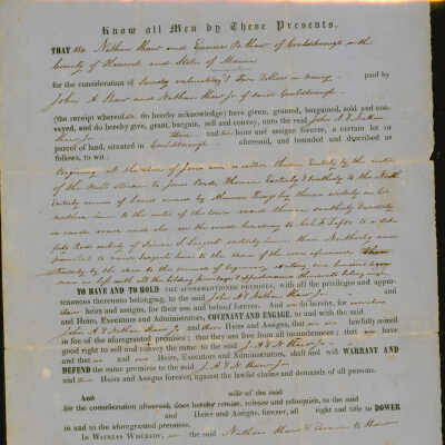 Deed for property transfer from Nathan and Eunice Shaw to John and Nathan Shaw Jr. in 1859