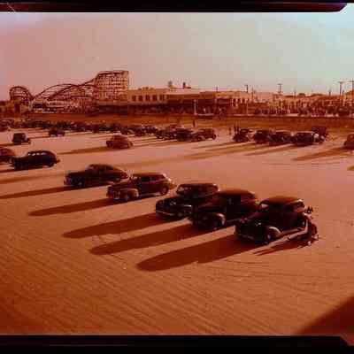Cars on Jacksonville Beach in Front of Amusement Park